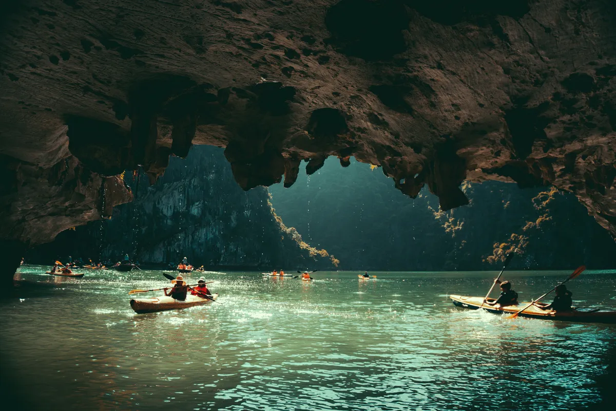 Kayakers paddling through calm water