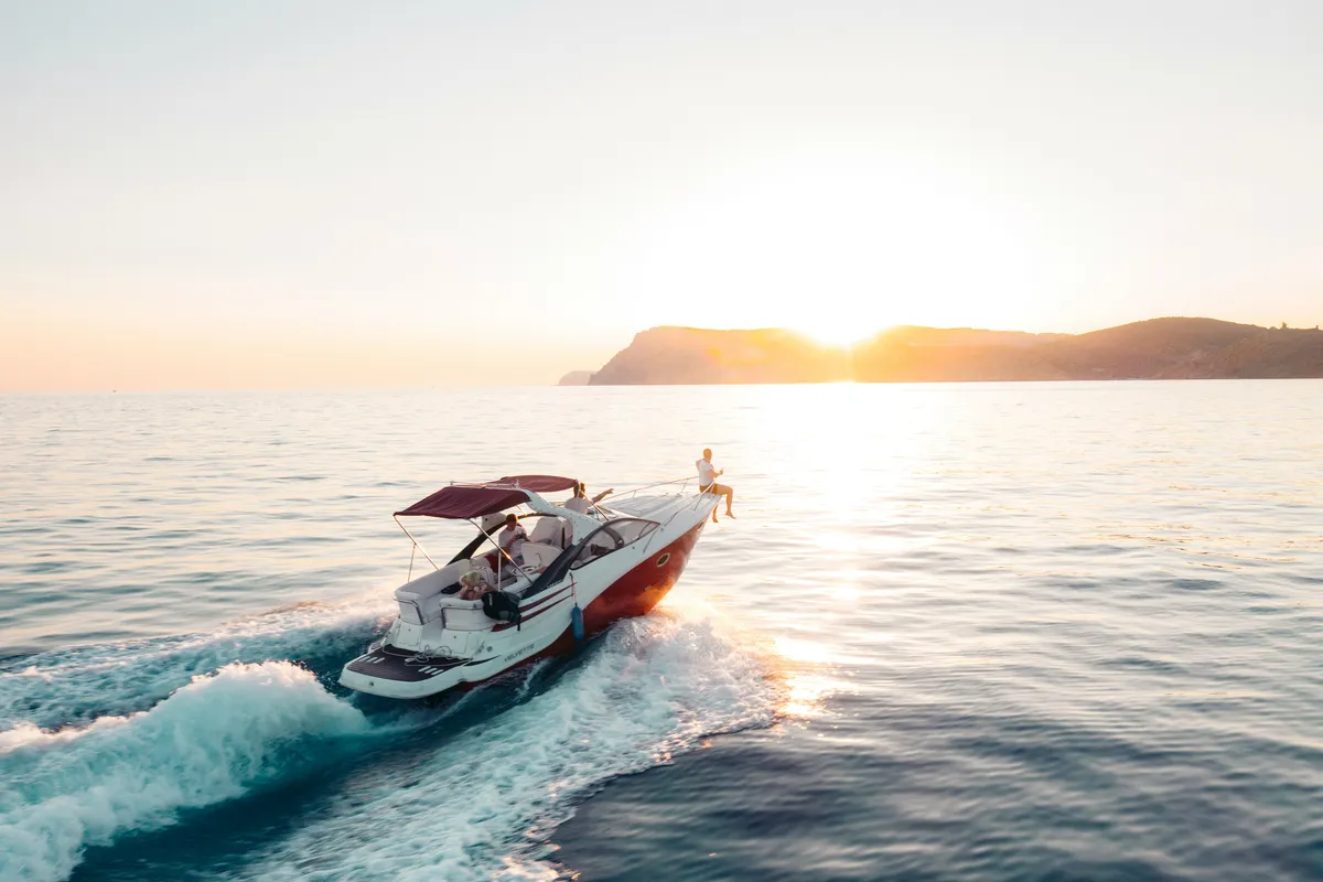 Motor yacht at sunset